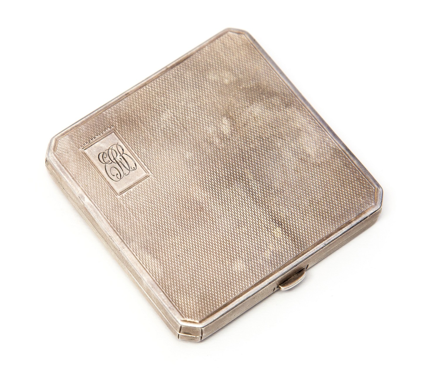 An Art Deco silver compact with integrated Coty lipstick, engine turned, Bravingtons,