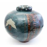 David Frith, a large studio pottery vase, spherical form, decorated with leaves and berries,