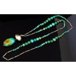 A Modernist silver and turquoise necklace, bead and baton form,