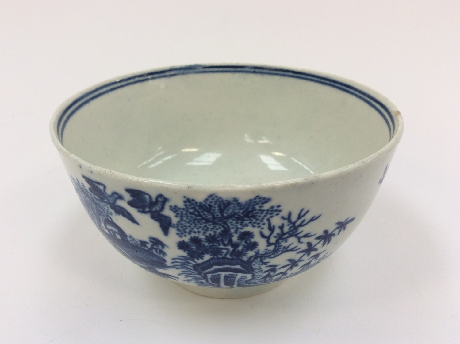 An 18th Century Worcester blue and white bowl, decorated with figure fishing and landscapes,