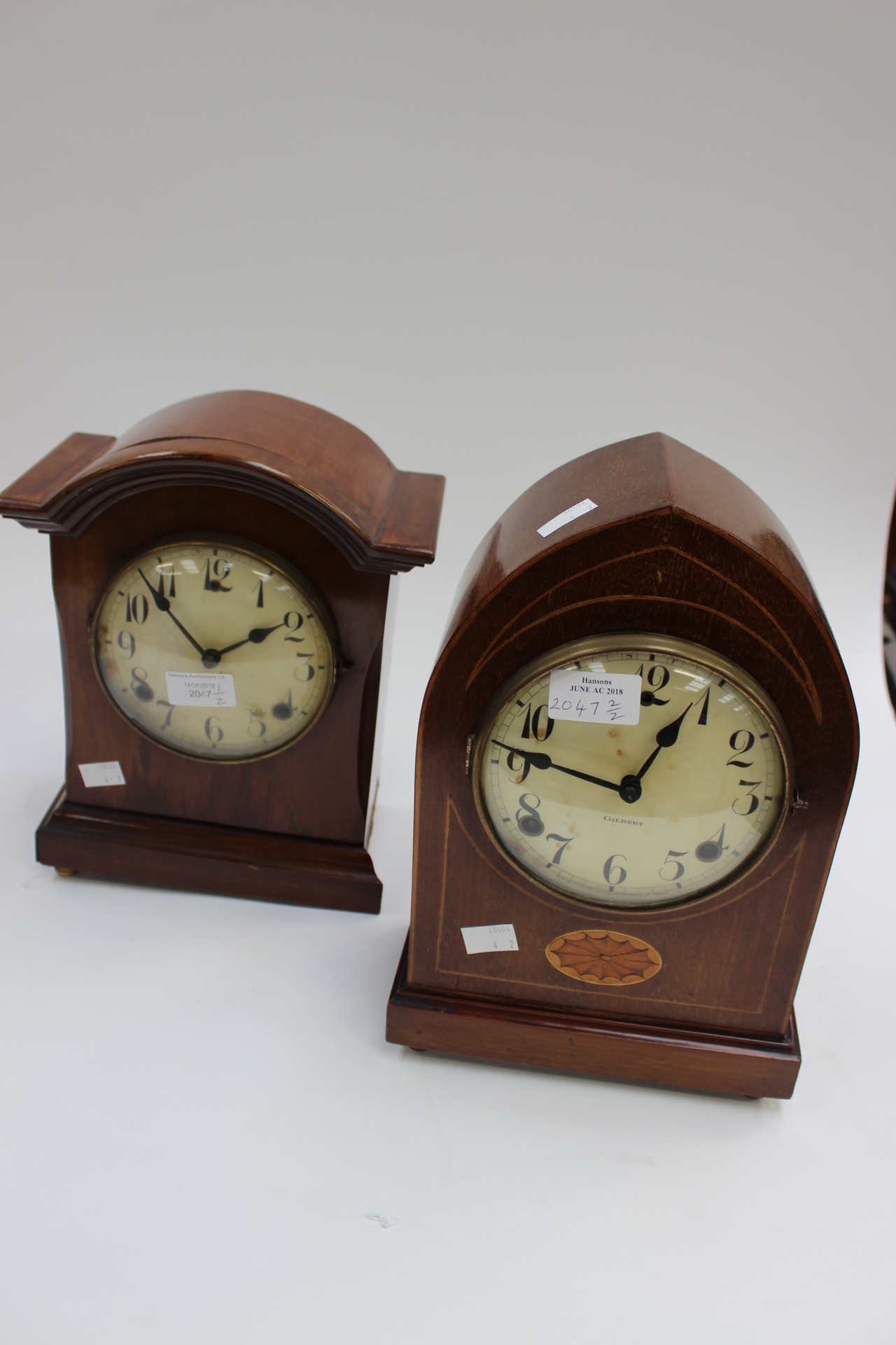 A 1930s style domed and cased Gilbert mantle clock with inlaid patera & another Gilbert mantle clock