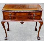 A George II style mahogany canteen, the case with shell carved cabriole legs, ball and claw feet,