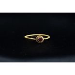 Medieval (13th - 15th century AD) Gold ring with twisted wire band; bezel with flower shaped border,