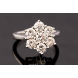 A diamond flower head 18ct white gold cluster ring, seven round brilliant cut diamonds approx 2.