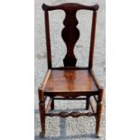 A George III set of four joined elm side chairs, of regional design,