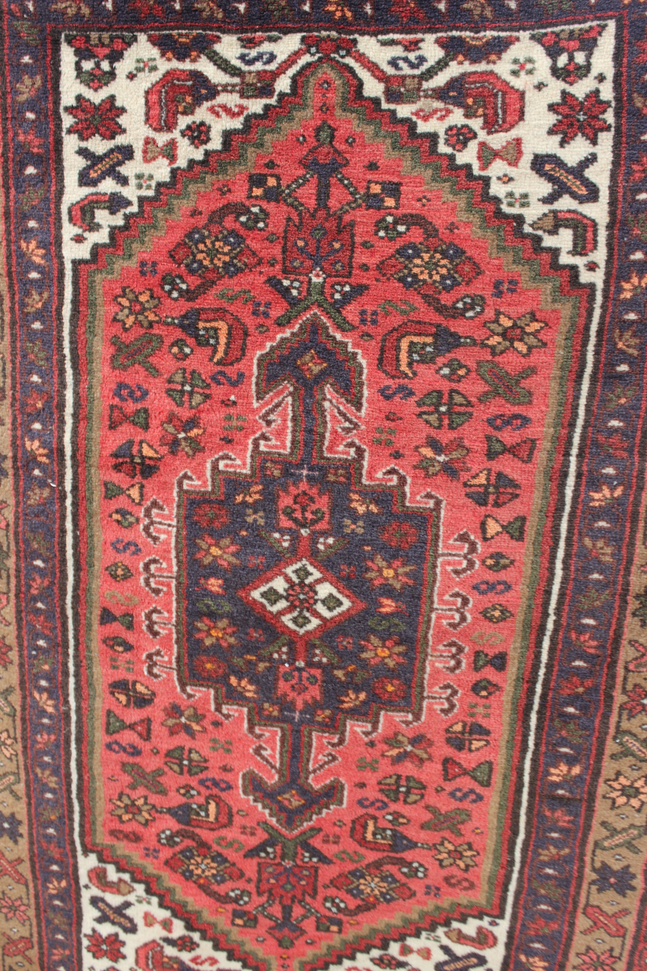 Hand knotted wool rug, red ground,