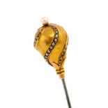 A 19th century yellow metal and pearl hat pin,