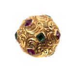 A 19th century yellow metal hat pin, embossed with foliate scrolls,