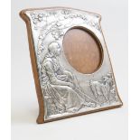 A silver Art Nouveau photograph frame made by Charles & Co,