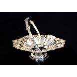 A Victorian silver swing handle basket, shaped circular with lobed sections,