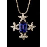 A tanzanite and diamond set 18ct white gold pendant and chain,