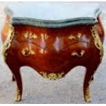 A 19th Century 'Bombe' commode, in the Louis XV style, having a marble top with moulded edge,