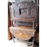 A 17th Century and later oak buffet, the base section originally a gateleg table,