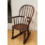 A 19th Century child's ash Windsor rocking chair,
