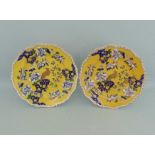 Two Masons Ironstone plates, yellow ground decorated with oriental flowers and a hollow rock bird,