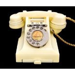 A rare 1950's ivory coloured GPO 300 series desk telephone, the handset dated 1952,