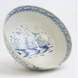 An English Delft blue and white punch bowl, circa 1760, watery landscapes,