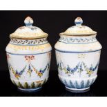 A pair of French faience tobacco or medicine jars, with covers,