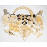 A large mixed parcel of assorted antique worked ivory and bone carvings, to include cocktail sticks,