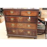 A George II oak chest of drawers, comprising two short over three long graduated drawers,