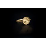 Greek (Mid 4th century BC) A gold ring with plain band;