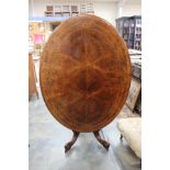 A Mid Victorian walnut quarter veneered pedestal loo table,