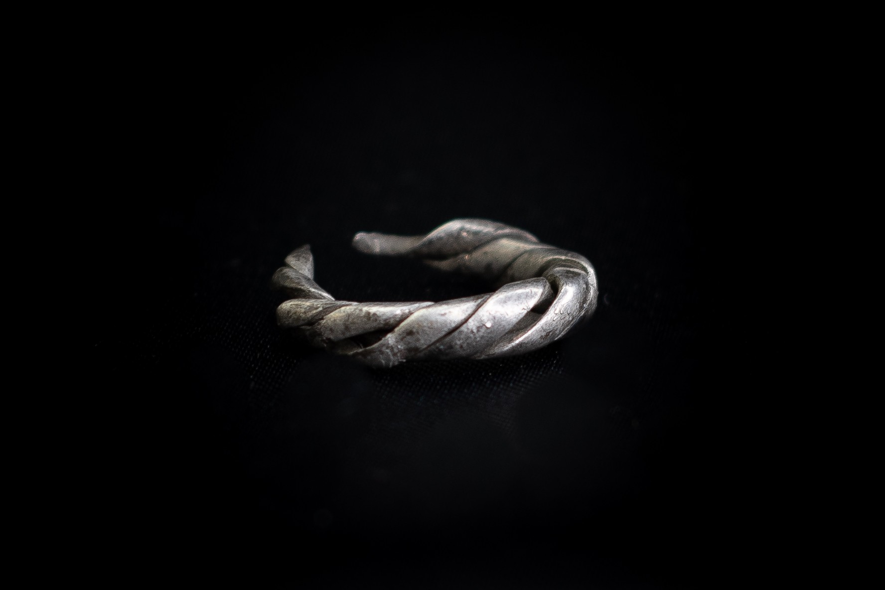 Viking (9th-12th century AD) Silver ring composed of three wide strips plaited together tapering to