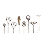 Hat pins - a collection of silver pins, including Samuel M Levi, depicting a female playing a harp,