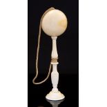 A 19th Century ivory bilboquet (cup and ball game), probably French, baluster turned stem,