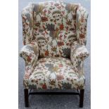 A George III mahogany wing-back armchair, circa 1780, with Sanderson upholstery,