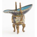 A Chinese cloisonne archaistic tripod vessel (jue), late Qing Dynasty, decorated with taotie masks,