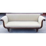 An early Victorian mahogany cream upholstered settee, the frame with scrolled arms,