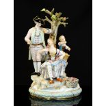 A Meissen figure group, D94, modelled as a courting couple with child and tree,