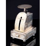 A set of Edwardian novelty Postal Scales, on plinth base with pull out stamp drawer on ball feet,