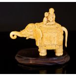 A 19th Century Chinese ivory lidded vessel, in the form of a strolling elephant wearing a howdah,