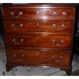 A George III mahogany chest of drawers, having a cross-banded top,