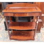 A Victorian flame mahogany serpentine fronted buffet, circa 1860, well section to the top,