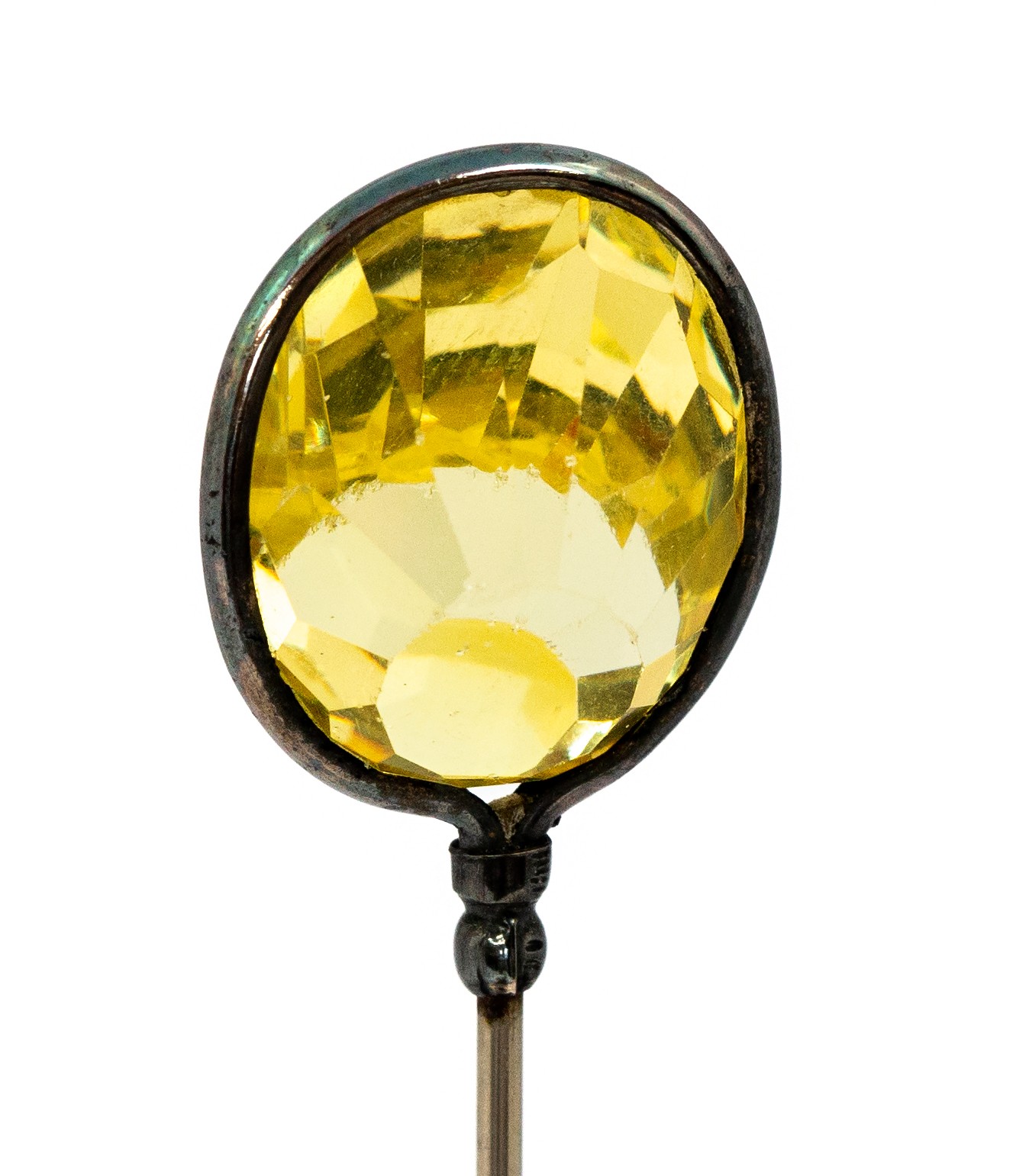 Charles Horner - An Edwardian silver hat pin, set with a fancy facet-cut stone,yellow glass,