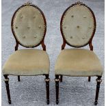 A pair of late 19th Century French side chairs, with oval backs,