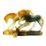 Daum, a pate de verre glass figure group of two horses, blue green and amber,