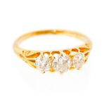 A diamond three stone 18ct yellow gold ring, the three old cut diamonds weighing total approx 1.