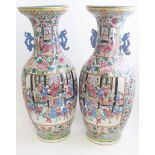 A pair of mid 19th Century Canton famille rose vases,