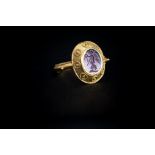 Roman (2nd-3rd century AD) A gold ring with ridged band, twisted rope pattern border to the edge,