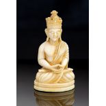 A 19th Century oriental ivory carving of a seated Buddah,