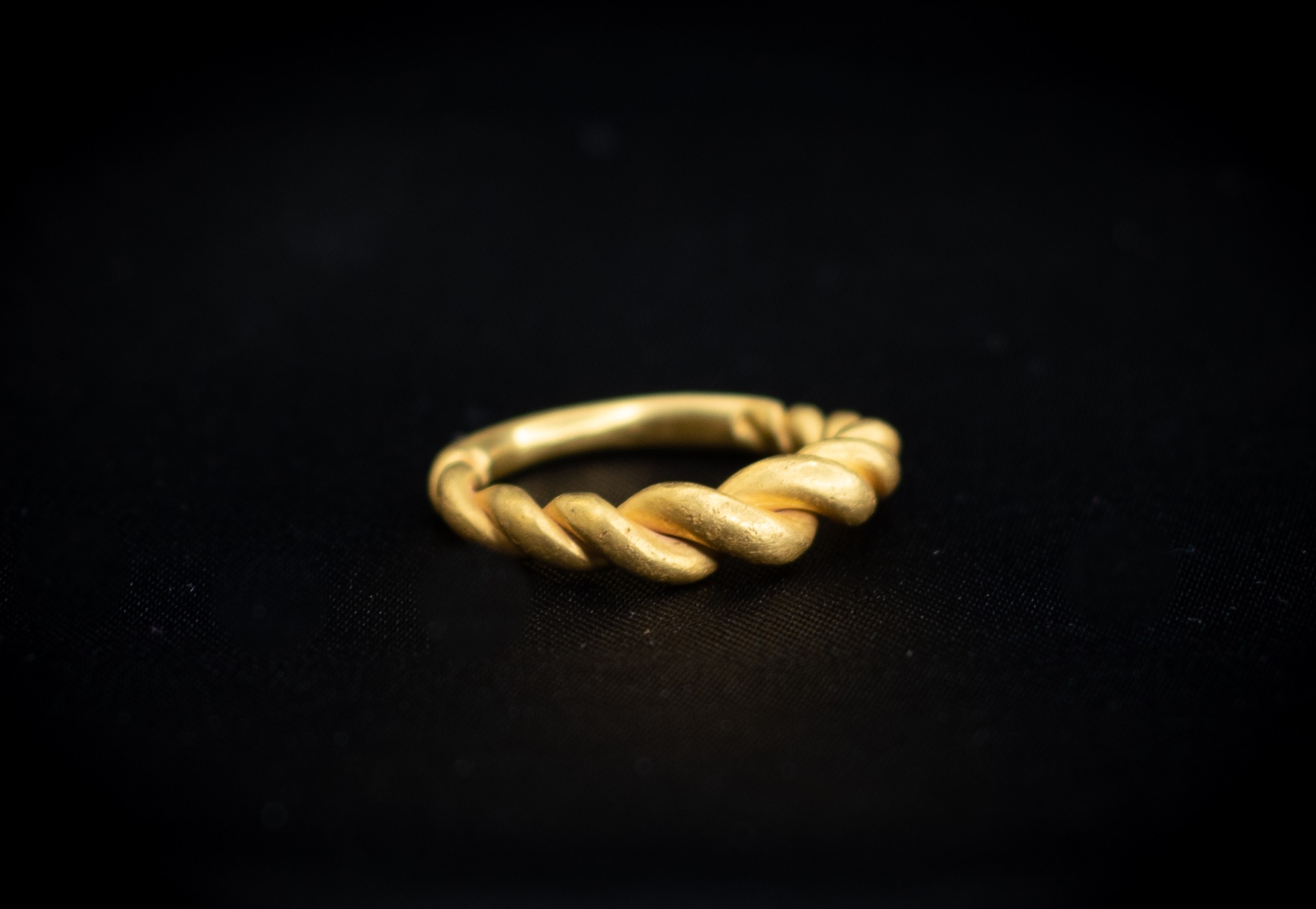 Viking (9th-12th century AD) Gold ring consisting of bands of wire plaited and widening to the