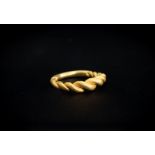 Viking (9th-12th century AD) Gold ring consisting of bands of wire plaited and widening to the