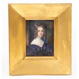 A mid 19th Century portrait miniature of a young lady in a purple dress, circa 1830's, on ivory,