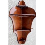 A pair of mahogany corner wall hanging display shelves (2)