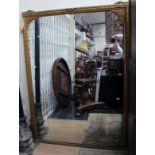 A large Victorian gilt gesso edged framed overmantle mirror, measuring approx 140cm wide,