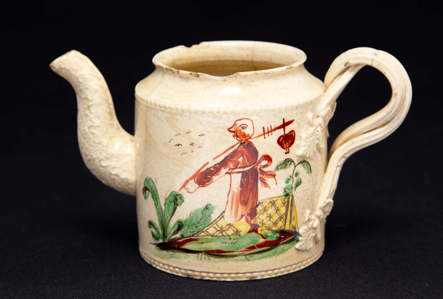 An 18th Century creamware teapot and cover, circa 1780, probably Leeds,